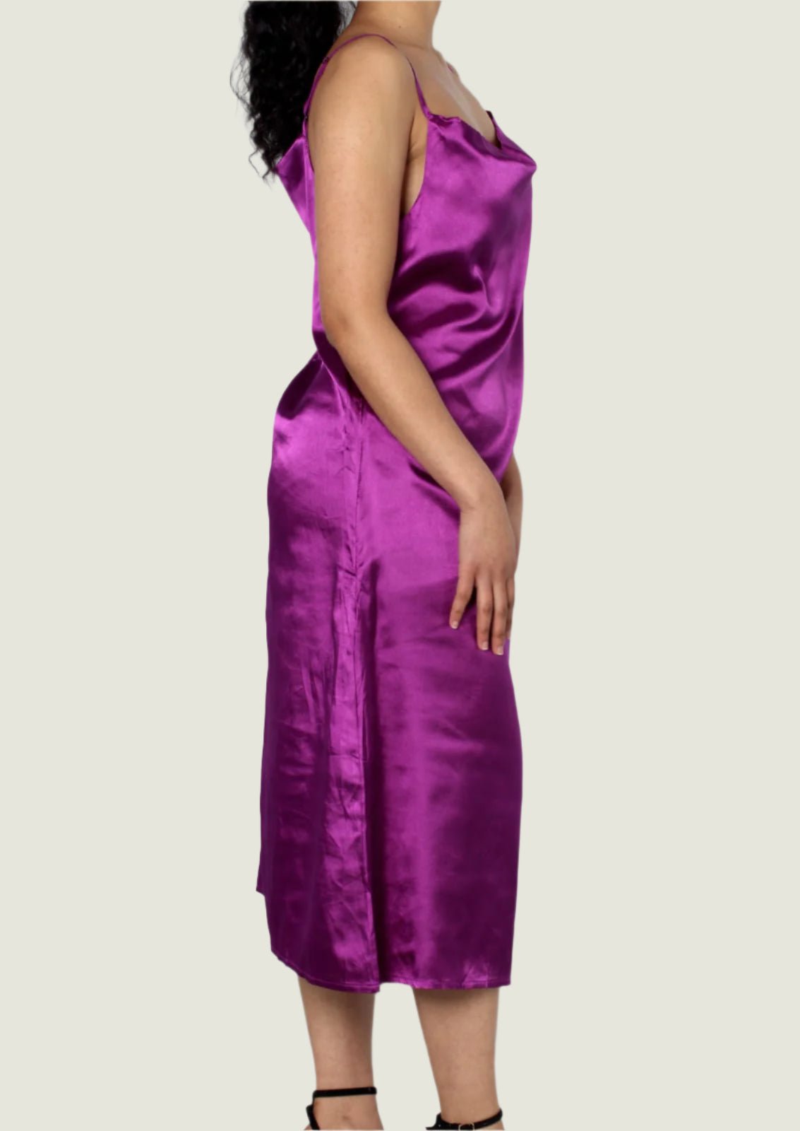 Purple satin dress worn by a person on a white background