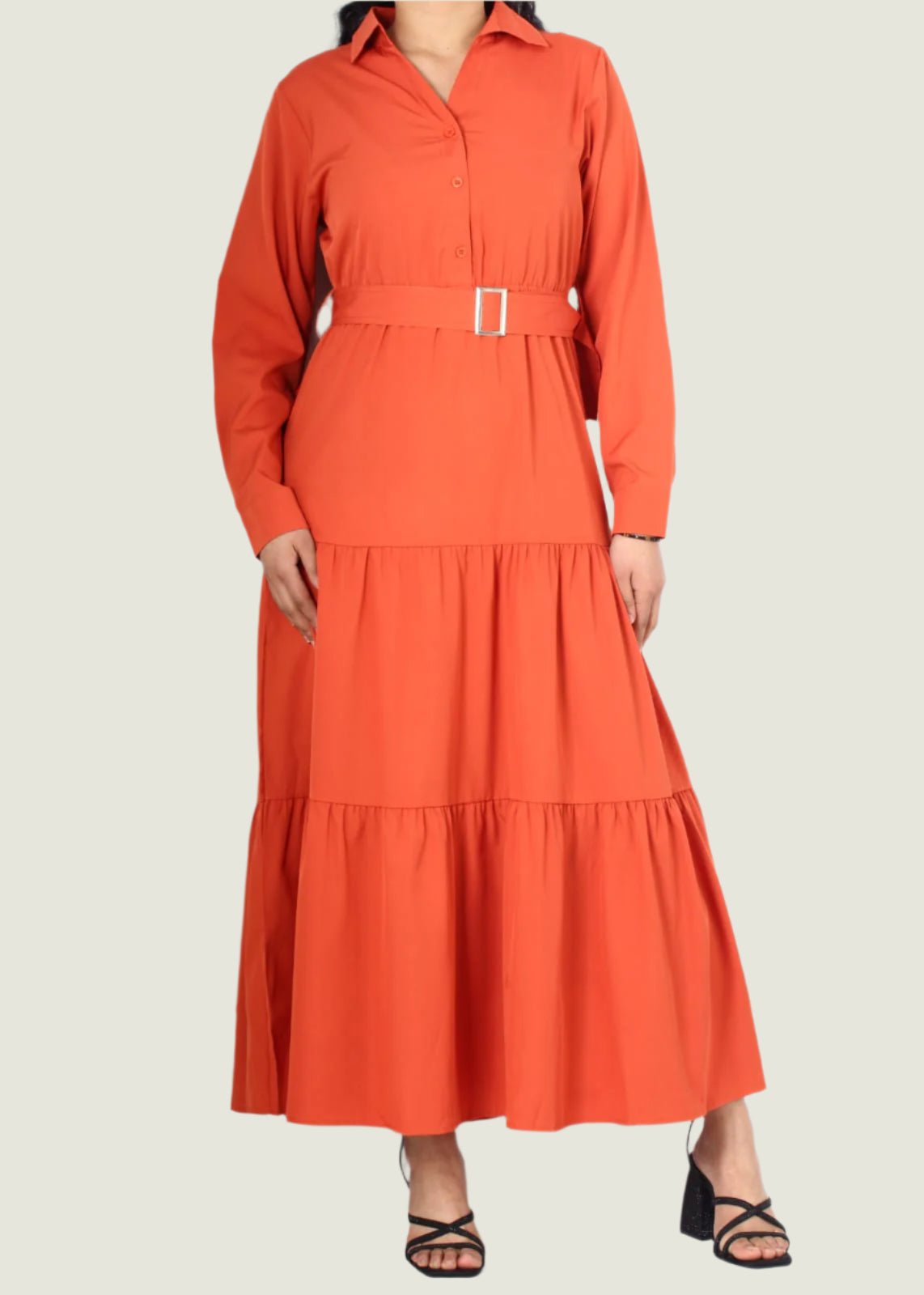 Orange dress with a belt on a white background