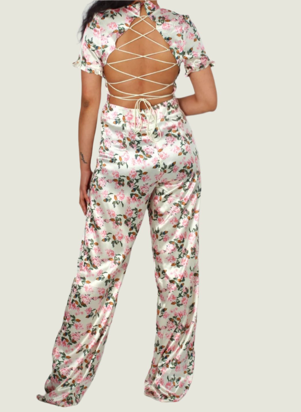 Floral Satin Bloom Jumpsuit – Graceful Power with a Lace-Up Twist