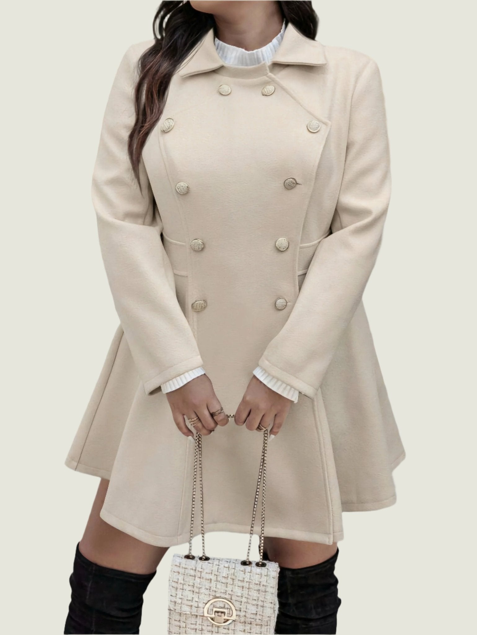 Person wearing a beige coat on a city street
