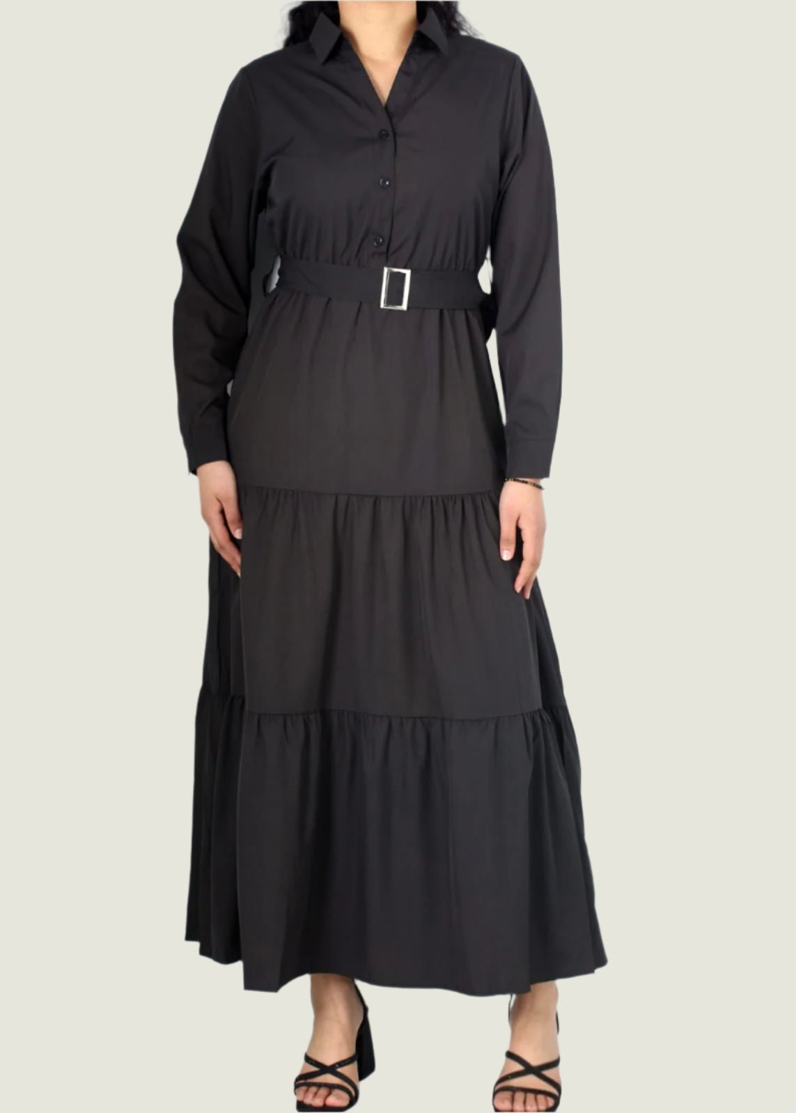 Black dress with a belt on a white background