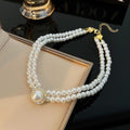 Women’s Layered Pearl Statement Necklace with Rhinestone Brooch Detail